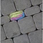 cobblestones with one colored with chalk, photo by flickr user naama